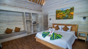 A room with a wooden bed, a bench, and a painting on the wall. - Blue Sky Villa Ceningan by ABM  (Ceningan Island)