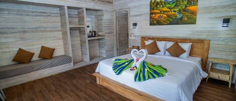 A room with a wooden bed, a bench, and a painting on the wall.