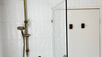 Shower, hair dryer, towels, soap