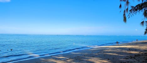 On the beach, white sand, beach towels