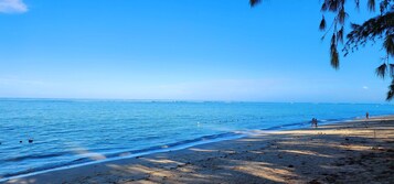 On the beach, white sand, beach towels
