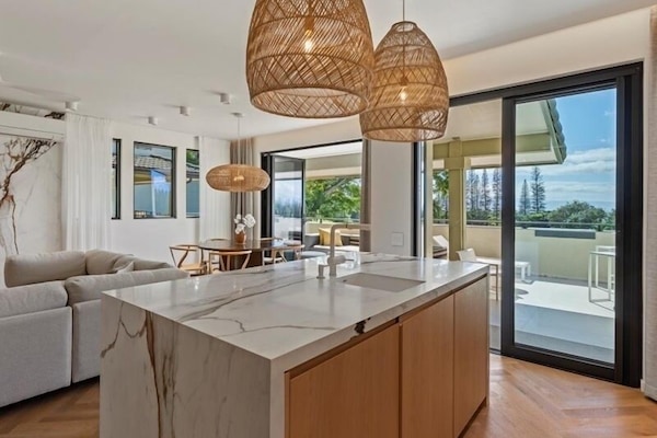 Rainfall marble kitchen island with sink for easier entertainment