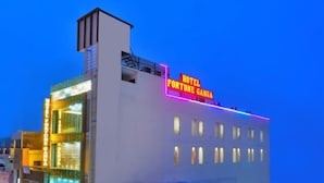 A hotel with a neon sign reading "HOTEL FORTUNE GANGA". - Hotel Fortune Ganga (Haridwar)