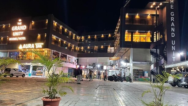 A hotel named "The Grand Unity" with a spa and multiple floors. - The Grand Unity (Garudeshwar)