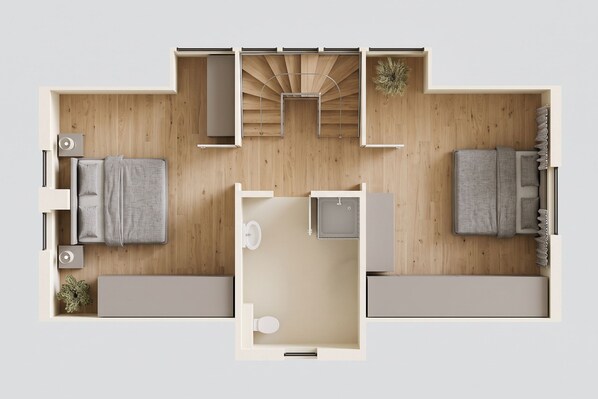 A floor plan of a hotel room with a bed, a small kitchenette, a bathroom, and a seating area.