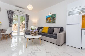 Deluxe Apartment | Living area | Flat-screen TV - Villa Capitis in the Centre with deluxe pool (Hvar)