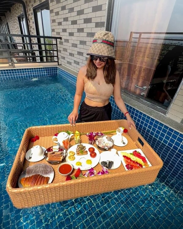 Outdoor pool, open 7:00 AM to 8:00 PM, pool umbrellas, pool loungers