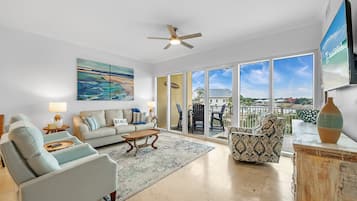 Signature Condo, 3 Bedrooms, Balcony, Beach View | Living room | 65-inch Smart TV with cable channels
