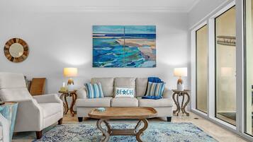 Signature Condo, 3 Bedrooms, Balcony, Beach View | Living room | 65-inch Smart TV with cable channels