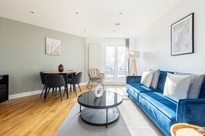 Apartment | Living area | 37-inch TV with cable channels, Netflix, streaming services - The Wembley Collection (Wembley)