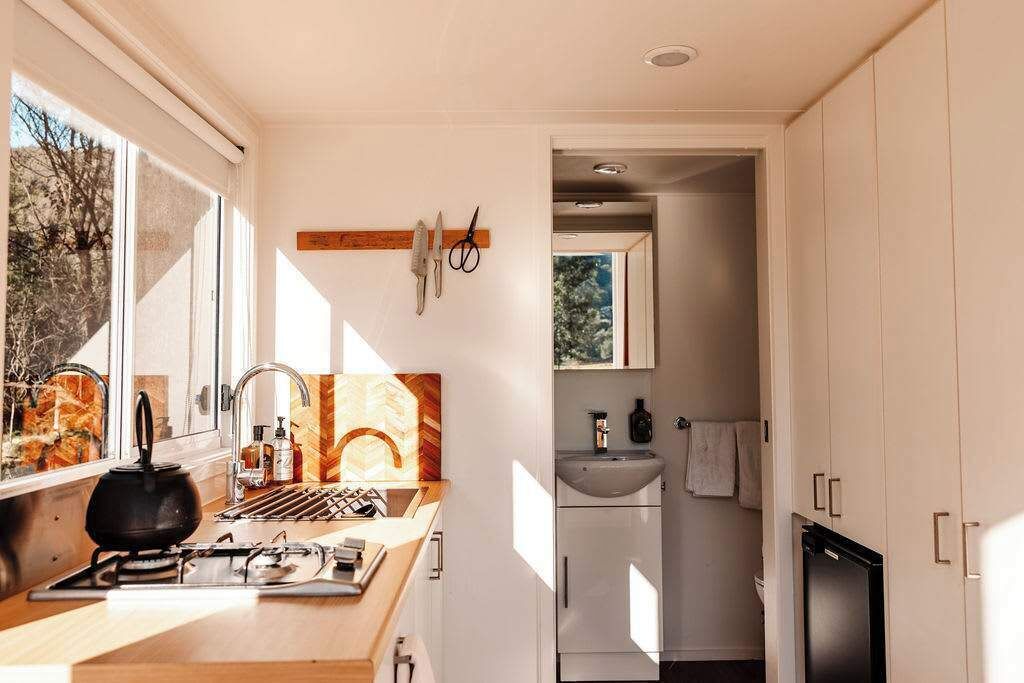 Fridge, stovetop, electric kettle, cookware/dishes/utensils