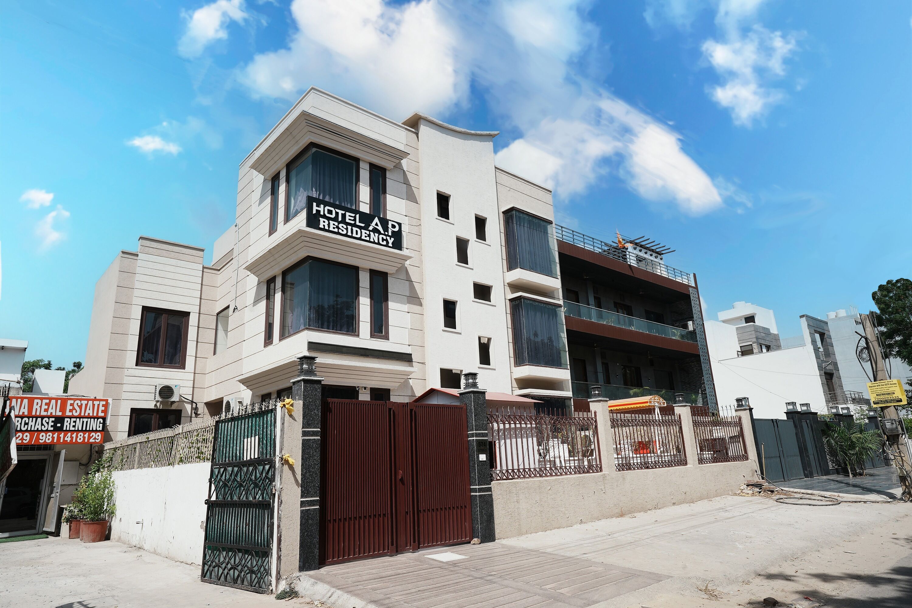 A modern multi-story building with a sign for 'Hotel A.P Residency'.