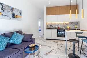 Fridge, electric kettle, cookware/dishes/utensils