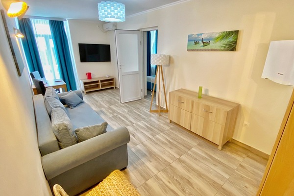 Junior Apartment, Balcony | Living area | 60-cm LCD TV with cable channels