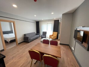 City Apartment | Living area | Flat-screen TV