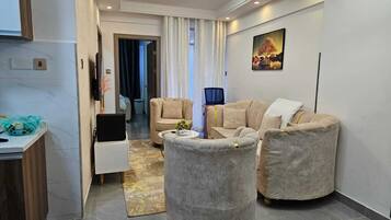 Family Apartment | Living area | 24-cm Smart TV with digital channels