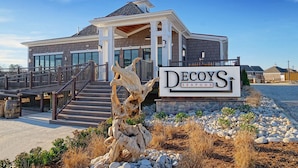 A modern house with a sign reading "Decoys Seafood." - Decoys (Suffolk)