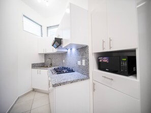 Fridge, microwave, stovetop, coffee/tea maker