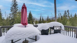 A snow-covered deck with a grill and a red umbrella. - Hike + Ski: Grand Lake Cabin w/ Mtn-view Deck (Grand Lake)