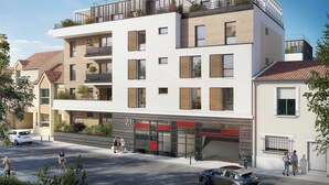 A modern multi-story residential building with balconies, large windows, and a garage entrance.