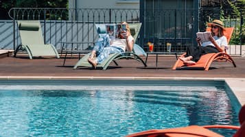 Seasonal outdoor pool, pool loungers