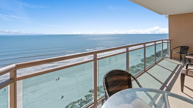 A balcony with a view of the beach and ocean. - 11th Floor Spacious Condo at Bahama Sands - 1103 (North Myrtle)