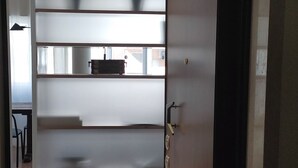 A room with a sliding door leading to a balcony. The door has a handle and a lock. - House St. Peter Rome (Roma)