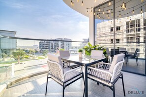 Outdoor dining - Magnificent 2BR with Private Pool at Samana Golf Ave. DSC by Deluxe Holiday Homes (Dubai)