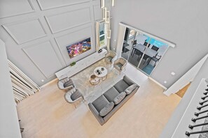 Spacious Living Area of the Home in Davenport Florida - Smart TV and Netflix - High Ceilings for spacious feel - Easy access to outdoor space with cozy seating - Statement Lighting