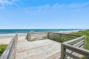 A wooden boardwalk leading to a beach with ocean views. - Knot Home -- 16BR OF in Corolla with Pool, Elevator, Theater, Game Room and More! (Corolla)