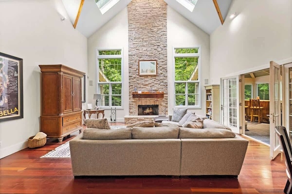 Relax under skylights in this grand, cozy retreat.