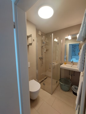 Shower, hair dryer, towels, soap