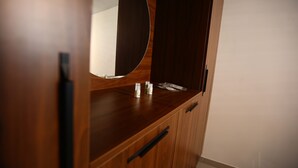 A wooden vanity with a mirror, a sink, and a few toiletries. - Moderne Loft Wohnung Koblenz (Koblenz)