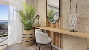 A modern room with a wooden wall, a large mirror, a potted plant, a desk, and a chair.