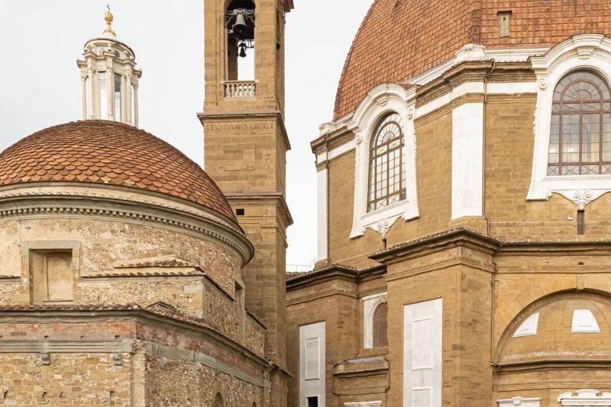 A historical building with a bell tower and domed roof.