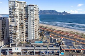 Enjoy expansive views of the coastline and distant mountains from the upper-floor balcony.