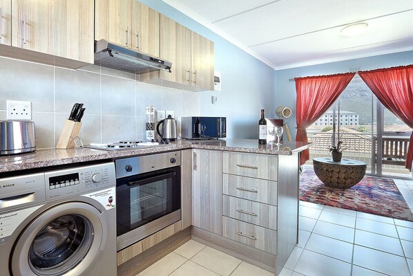 Fridge, microwave, oven, stovetop - Ocean Breeze 59 - Two Bedroom Apartment, Sleeps 4 (Cape Town)