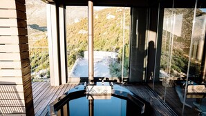 A hot tub on a wooden deck with a mountain view. - Klein-Hangklip - Two Bedroom House, Sleeps 4 (Cape Town)
