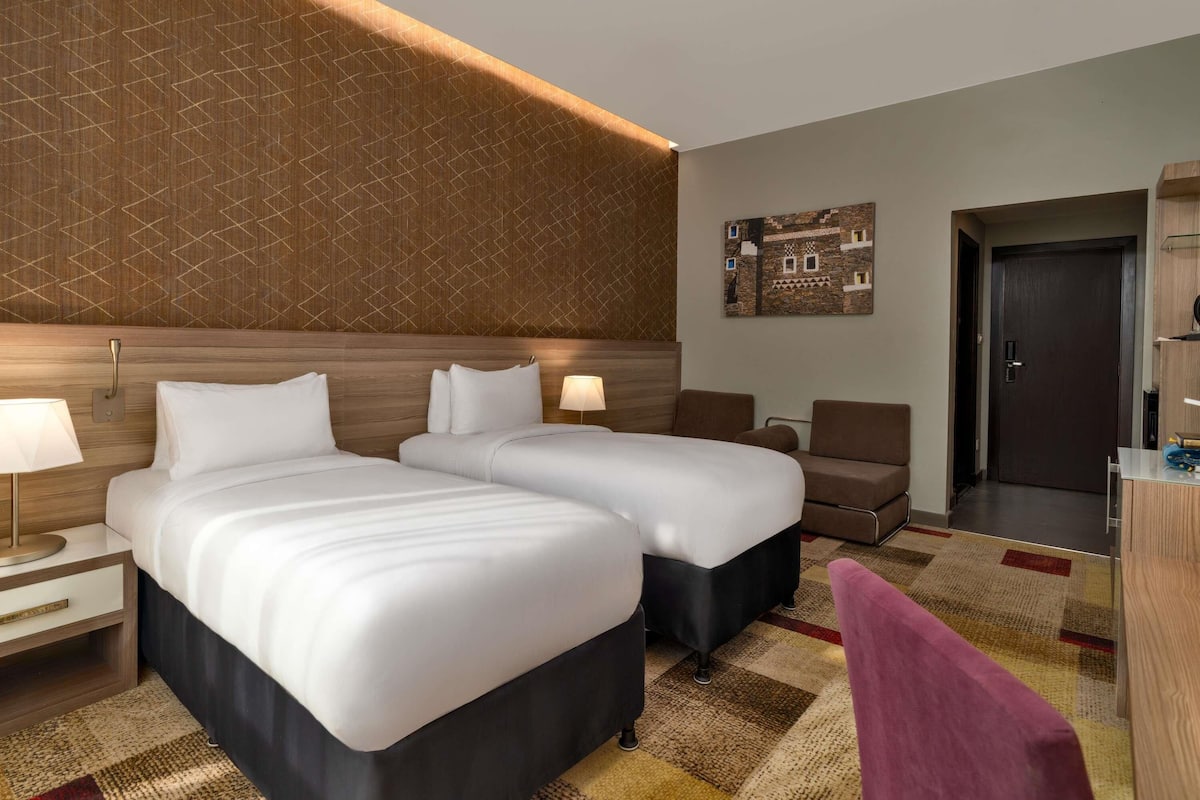 Habitación clásica, 2 camas individuales | Caja fuerte, sistema de insonorización, wifi gratis y ropa de cama