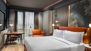 Deluxe Suite, 1 King Bed | Premium bedding, minibar, in-room safe, desk