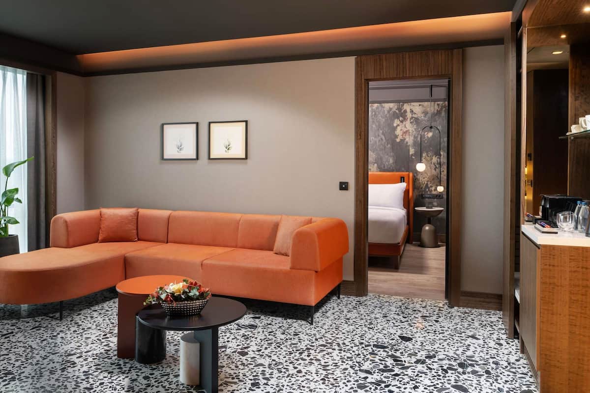 Deluxe Suite, 1 King Bed | Premium bedding, minibar, in-room safe, desk