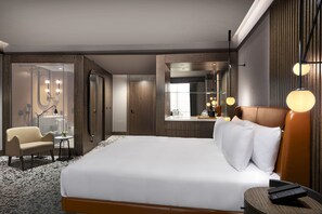 Deluxe Suite, 1 King Bed | Premium bedding, minibar, in-room safe, desk