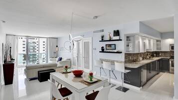 Luxury Condo | Living area | 50-inch Smart TV with cable channels