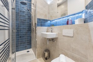 Shower, hair dryer, towels, soap