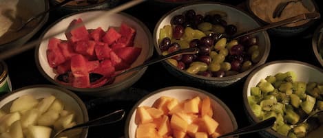 A variety of fruit bowls arranged on a table.