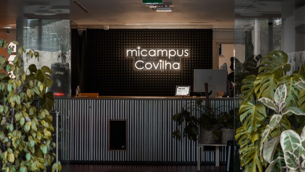 A reception desk with a sign reading "micampus Covilha" and a "TIME OUT" sign. - Micampus Covilhã (Covilhã)
