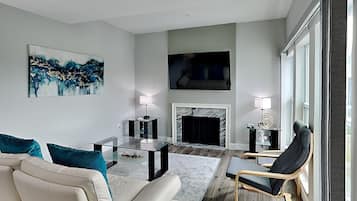 Condo, Multiple Beds, Pool Access (unit 247G) | Living area | TV, fireplace