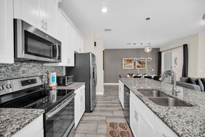 Fridge, microwave, stovetop, dishwasher - EV_9073 - 4 Bed 3 Bath Townhome with Screened-In Pool, Kids Bedroom (Davenport)