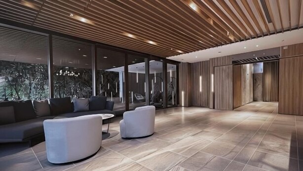 A spacious lobby with a modern design, featuring a large seating area with sofas and armchairs, a tiled floor, and large windows allowing natural light. - Boutech Jiantan Hotel (Taipei)