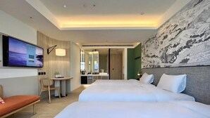 A hotel room with a TV, two beds, a desk, and a large painting on the wall. - Boutech Jiantan Hotel (Taipei)